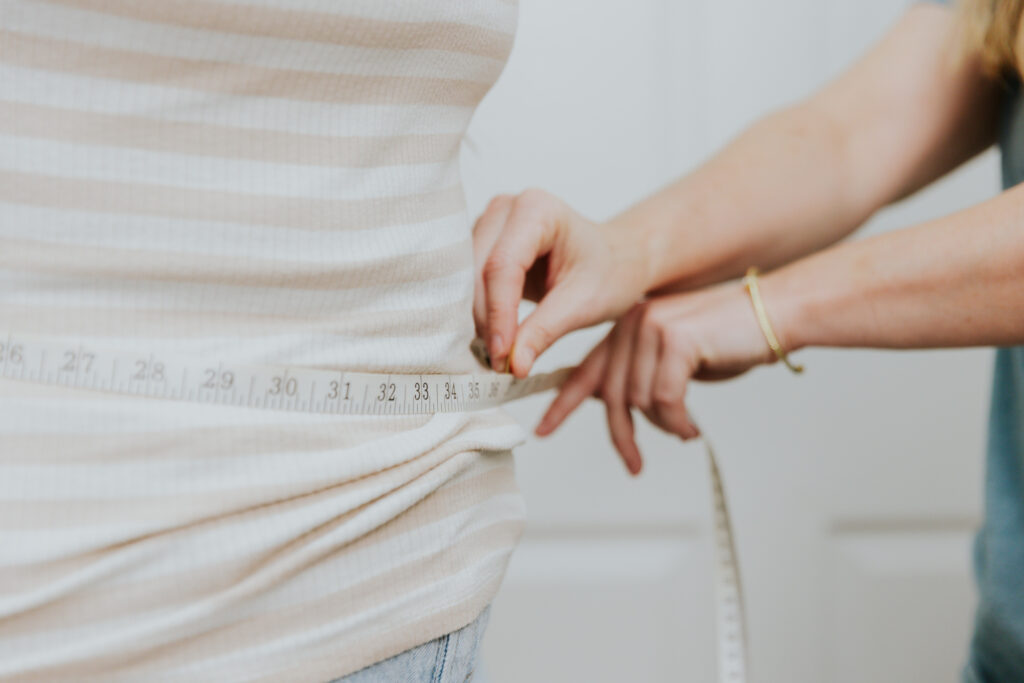 A woman monitors her results after weight loss injections in Dallas